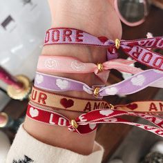 Bracelets with text to make you happy. The ribbon includes Amour, Love and J'adore. Nice for yourself but of course also as a gift! And easily adjustable by the handy sliding bead.
 Material: Cotton with polyester and gold-plated with E-coating.
 Size: one size fits all due to the sliding bead. Dior Lip Glow, Ribbon Bracelets, Elastic Ribbon, Bracelet Knots, Beads Bracelet Design, Bracelet Design, Lip Glow, Beads Bracelet, You Are Awesome