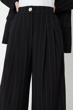 Sophisticated wide-leg trousers with a flattering high-rise waist
Crafted from a premium woven fabric with a subtle pinstripe pattern
Designed with a concealed front fastening for a sleek look
Featuring belt loops to allow for a customised fit
Cropped length creates a modern, on-trend silhouette
Exude effortless elegance with these wide-leg trousers from Wallis. The pinstriped design lends a polished touch, making them ideal for smart casual events or the office. Style with a tucked-in blouse and heels for a refined look that radiates sophistication. Alternatively, pair with a camisole and blazer for a chic evening ensemble that conveys timeless glamour. Striped Wide Leg Trousers, Occasion Dresses Wedding Guest, Timeless Glamour, Pinstripe Pattern, Petite Jumpsuit, Petite Coat, Blouse Sale, Tall Clothing, Petite Tops