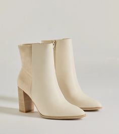 A stylish staple bootie to pull your look together! The bootie features a mixed faux suede and faux leather material, a pointy toe, a tall stacked block heel, and an inner zipper closure. Complete with your favorite cardigan and high waist jeans. Fit & Features3.5” Block heel, 5" leg opening, 3" shaft height50/50 faux suede and faux leather materialAnkle-fitPointy toe Inner zipper closureRuns true to size Cream Leather Heeled Boots For Winter, Cream Faux Leather Boots For Winter, Winter Cream Faux Leather Boots, Cream High Heel Faux Leather Boots, Beige Faux Leather Heeled Boots For Fall, Cream Faux Leather Boots Medium Width, Beige Faux Leather Boots For Work, Cream Medium Width Faux Leather Boots, Chic Cream Faux Leather Boots