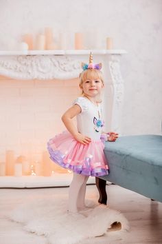 This stunning unicorn outfit is perfect for First birthday, magical unicorn party, photo shoots and other happy events :)You will create real magical holiday for your baby with this lovely unicorn tutu set!Awesome unicorn outfit has delightful light pink tutu skirt with purple lavender ribbons.Bodysuit / T-shirt has lovely unicorn print with nice flowers.Also I can add your baby's name and number of age.Free personalization :)More magical unicorn outfits:https://etsy.me/305qcxZMermaid outfits ht