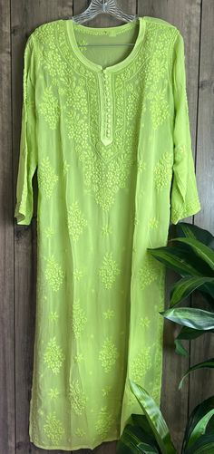 "Trendy \"ghaas patti \" Chikankari green kurta on fine flowy georgette. Beautifully hand embroidered! Liner included. Kurti length-49 inches \"Embroidery designs may slightly vary \"" Luxury Chikankari Embroidered Tops For Party, Luxury Chikankari Embroidered Dupatta For Spring, Light Green Kurti Design, Eid Kurta With Floral Embroidery In Green, Green Floral Embroidery Kurta For Eid, Green Floral Embroidered Kurta For Eid, Anarkali Green Kurta With Chikankari Embroidery, Bohemian Pista Green Kurta For Diwali, Green Bohemian Georgette Kurta