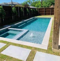 an empty swimming pool in the middle of a backyard