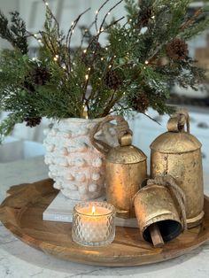 a tray with candles and ornaments on it