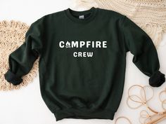 Campfire Crew Sweatshirt | Perfect sweatshirt for an outdoor lover - or the perfect gift for a hiker or camper! The perfect relaxed-fit pullover sweatshirt! This crewneck sweatshirt is made to order, and features a cotton and polyester blend that's soft to the touch and cozy on the inside.  COLORS This sweatshirt is available in in 8 different colors: - White - Black - Navy - Heather grey (dark grey) - Ash Grey (light grey) - Maroon - Forest Green - Sand SIZING - This is a loose-fit unisex sweatshirt available in sizes S-5XL, and fits true to size.  - For an oversized look I recommend sizing up 1-2 sizes.  - For more sizing measurements details see the size chart in the last photo. CARE INSTRUCTIONS - Machine wash cold (max 30C or 90F) - Tumble dry low heat - Do not iron - Do not dry clean Outdoor Crew Neck Sweatshirt With Ribbed Cuffs, Sporty Crew Neck Sweatshirt For Outdoor, Sporty Crew Neck Sweatshirt For Hiking, Sporty Crew Sweatshirt For Outdoor, Crew Sweatshirt For Outdoor Activities In Fall, Casual Crew Sweatshirt For Outdoor Activities, Fall Camping Crew Neck Sweatshirt, Fall Crew Neck Sweatshirt For Camping, Outdoor Crew Sweatshirt With Letter Print