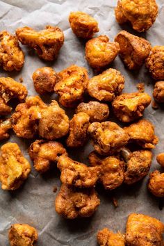 some fried food is sitting on a piece of paper