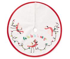 a white bib with flamingos on it and the words happy birthday written in red