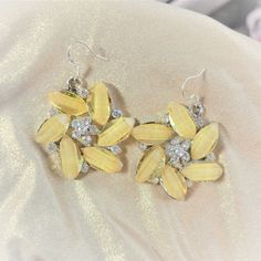 Statement Pastel Yellow Crystal Flower Statement Earrings These Earrings Are Gorgeous. Bold, Beautiful & Oh So Fabulous, Flower Statement Earrings Are Everything You’ll Need To Make A Statement On Your Wedding Day Pr Special Event. Handcrafted With Sparkling Crystal Gemstones! #Flowerearrings #Statementearrings #Yellow #Crystal #Pastel Statement Pastel Yellow Crystal Flower Statement Earrings. Wedding Flower Earring. Oversized Flower Earring. Brides Maid Flower Earring.Flower Earring. Floral Sta Elegant Yellow Dangle Flower Earrings, Elegant Yellow Flower Earrings For Wedding, Elegant Yellow Flower Shaped Earrings, Elegant Yellow Flower-shaped Earrings, Yellow Ear Wire Party Earrings, Yellow Jewelry With Ear Wire For Party, Yellow Earrings For Party, Yellow Flower Earrings For Party, Party Jewelry With Yellow Ear Wire