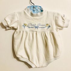 Vintage from 1989 baby boys white embroidered romper. Front is embroidered with "thank heaven" with dainty scalloped edges on limbs and neck. Snaps in back end at stride. Very soft stretch knit fabric. Brand- Little Me No size- I'm the original owner, and it's comparable to up to three months. Measurements- 13.5" shoulder to stride, 12" across. Please view all images as they are part of the description. About my shop items-  Every listing features a detailed written description along with images Vintage Baby Accessories, Fitted Cotton Bodysuit For Baptism, White Onesie For Baptism In Spring, Fitted White Onesie For Baptism, White Short Sleeve Onesie For Baptism, White Fitted Onesie For Baptism, Vintage Newborn Clothes, Baby Clothes Vintage, Spring Baptism Cotton Onesie