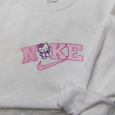 Introducing our Kitty Nike Embroidered Sweatshirt, a trendy and unique addition to your wardrobe. Made with premium quality material, this Trendy Online Clothing Stores, Nike Embroidered Sweatshirt, Pokemon Sweatshirt, Nike Inspired, Nike Stuff, Perfect Girlfriend, Surprise Your Girlfriend, My Christmas Wishlist, Embroidered Apparel