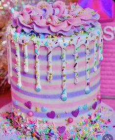 a birthday cake decorated with sprinkles and decorations