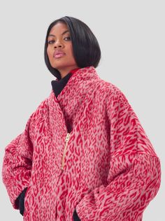 The Eren coat is an iconic piece at Heimstone, drawing inspiration from the kimono. This oversized, long coat is crafted from soft, fluffy wool, ensuring comfort and warmth throughout the winter season. Designed to wrap and cocoon you, it features a silver metallic zipper for closure. This edition is reimagined in a bold and colorful red Opera leopard print, a signature touch of Heimstone. Model: 177 cm / Size: 2 Oversized Long Fur Coat For Spring, Oversized Chic Fur Coat For Cold Weather, Chic Oversized Fur Coat For Cold Weather, Chic Red Oversized Outerwear, Red Wool Oversized Outerwear, Red Oversized Wool Outerwear, Oversized Red Wool Outerwear, Red Oversized Long Coat Outerwear, Red Oversized Outerwear For Fall