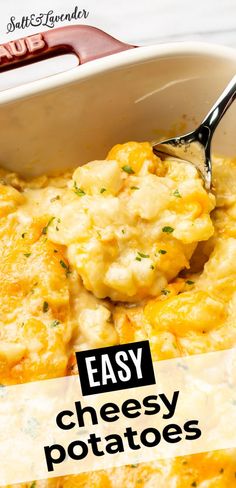 an easy cheesy potato casserole recipe in a white dish with a spoon