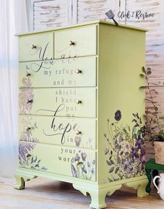 a yellow dresser with flowers painted on it and words written on the drawers that say you are my refuge