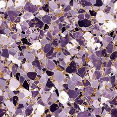 purple and gold speckled glass tiles with white dots on the bottom, in different shades