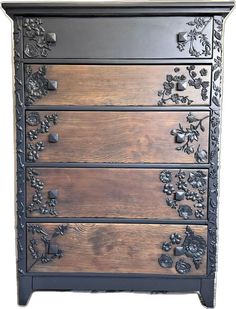 an ornate chest of drawers with wood and metal decorations