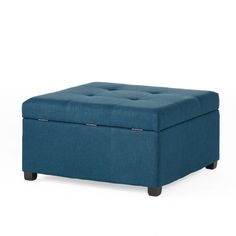 a blue ottoman sitting on top of a white floor