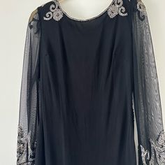 Stunning Intricate Black Dress- Sheer Sleeves With Silver Beading On Shoulders ,Wrists And The Hem! Enticing Open Back Embellished Long Sleeve Mother Of The Bride Evening Dress, Elegant Evening Dress For Mother Of The Bride, Elegant Festive Evening Mother Of The Bride Dress, Elegant Mother Of The Bride Dress For Evening Festivities, Black Sparkling Dress For Wedding, Elegant Embellished Long Sleeve Mother Of The Bride Dress, Black Sparkling Wedding Dress, Elegant Sparkling Evening Dress, Elegant Long Sleeve Mother Of The Bride Cocktail Dress