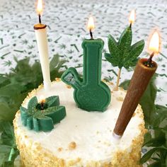 a cake with candles on it sitting on a table