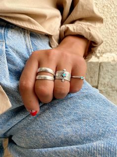 Three different stackable rings in silver color and similar philosophy. The first one is a ring that seems to have double bands. The second one is a wide ring with a turquoise rhombus charm from enamel at the center and the last one is a thin band with a turquoise heart that is made from enamel.the first two rings are slightly adjustable and the heart has fixed dimensions size 7. YTou can wear them all together or separetely as well. MATERIALS - All Rings are made from Peweter. - Turquoise Ename Rings In Silver, Rings Adjustable, Snake Jewelry, Rings Silver, Dope Jewelry, Statement Ring Silver, Funky Jewelry, Jewelry Lookbook, Trendy Earrings