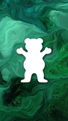 a green and white background with a teddy bear cut out on it's side