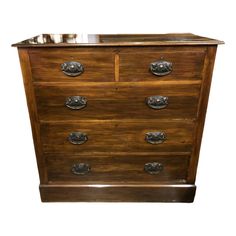 an old wooden dresser with metal handles