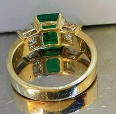 GORGEOUS 18K yellow gold emerald ring NATURAL GREEN COLOMBIA Emerald ring center emerald shape natural treated green emerald weight 2.05ct.size 9x6.7 nice vivid green color ,clean, very lively ,nice cut .very sparkly side two natural princess cut diamonds total weight 1.45ct H-SI1 Ring SIZE 6.5 Retail value $15,500 net. Cert Appraisal available Gia Certified Green Princess Cut Diamond Ring, Luxury Green Princess Cut Ring, Green Emerald Ring With Baguette Cut, Princess Cut Emerald Ring In Yellow Gold, Baguette Cut Green Emerald Ring, Gia Certified Green Princess Cut Rings, Fine Jewelry Green Princess Cut Diamond Ring, Green Princess Cut Diamond Ring In Fine Jewelry Style, Green Princess Cut Diamond Ring Fine Jewelry