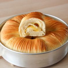 a pastry in a metal pan on a wooden table