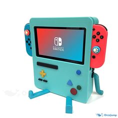 a blue and red nintendo wii game system with two controllers on it's legs