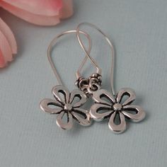 Cute silver plated flower earrings that hang on high quality Sterling silver ear wires. One of my favorite flowers. Comes wrapped ready for gift giving. Sterling Silver Flower Earrings For Mother's Day, Mother's Day Nickel-free Sterling Silver Flower Earrings, Mother's Day Silver Sterling Flower Earrings, Handmade Sterling Silver Flower Earrings For Her, Handmade Sterling Silver Flower Earrings As A Gift, Handmade Sterling Silver Flower Earrings As Gift For Her, Silver Flower Earrings For Mother's Day, Sterling Silver Flower Pendant Earrings As Gift, Mother's Day Sterling Silver Flower Earrings