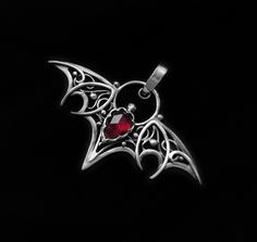 Bat, Bat pendant, Gothic pendant, Wire wrapped pendant, Ruby pendant, Pink ruby, Wire jewelry, Silver pendant, Halloween pendant, Halloween jewelry, Silver Jewellery, OOAK, One of a kind Jewelry, Unique jewellery Silver pendant "Bat Ruby" with beautiful pink ruby (treated). Silver patinated and polished by hand. Incredibly beautiful look! This pendant can be a wonderful addition to your image, as well as a memorable gift! Сompletely handmade! Height with a pendant holder 43mm (1.7") Width 53mm (2.08") Weight 4.1g The chain is not included in the price. Please, let me know if you'd like to buy this pendant with the chain. Please, contact me in case there are any questions about the product, shipment, or payment. If it's necessary, I can provide more photo or video. Vampire Piercing, Vampire Necklace, Bat Pendant, Bat Jewelry, Halloween Pendant, Gothic Pendant, Gothic Vampire, Pink Ruby, Jewellery Silver