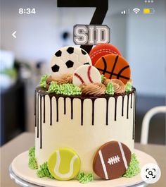 a birthday cake with sports themed decorations on it