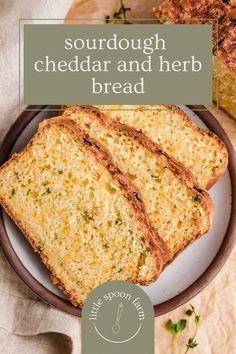 two slices of sourdough cheddar and herb bread on a plate