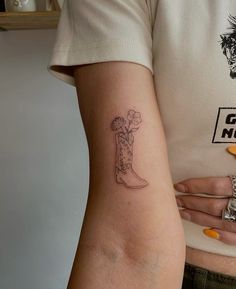 a woman with a tattoo on her arm