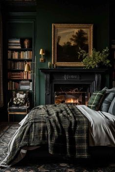 a bedroom with dark green walls and a fireplace in the corner is lit by candles