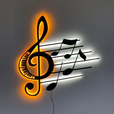 a neon sign with musical notes on it's side and a light up music note