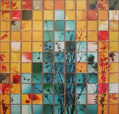 an image of flowers and plants in the glass mosaics on the building wall behind it