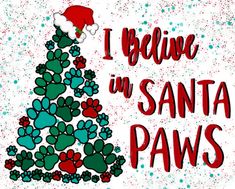 i believe in santa paws christmas tree with red and green snowflakes on it