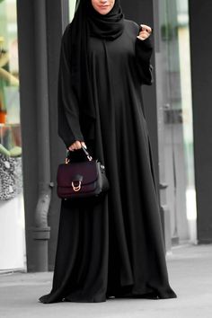 Grab this casual day to day abaya with seamless pockets! Customised in 10+ colors! Crafted in premium nidha quality assured. Look classy with this casual abaya.comes with a hijab! Abaya Noir, Black Abaya Designs, Simple Abaya, Casual Abaya, Abaya Design, Casual Attire For Women, Black Abaya, Abaya Style, Mode Abaya