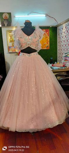 Pink designer ball lehenga with princes FLAIRY dress.. Material..net Imported net Embroidery..all hand U can customise according to your size also Pink Net Lehenga For Wedding, Pink Net Festive Dress, Pink Sequined Gown For Reception, Pink Net Choli For Reception, Bollywood Style Pink Sequined Lehenga, Festive Pink Sequin Gown, Pink Bollywood Gown With Sequins, Pink Sequined Floor-length Sets, Pink Floor-length Sequined Sets