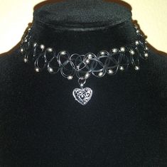 Thick Tattoo Choker Style Necklace With Beads Heart Charm Handmade With Love Stretch To Fit Perfect For Valentines Day Same Day Or Next Day Shipping Please Feel Free To Ask For Any Details/ Measurements Everything I List Is Cross Posted On Other Platforms, Snag It Before It's Gone Stay Blessed, Stay Safe. Shopsaritalynne Black Heart-shaped Metal Choker, Black Heart Charm Choker For Valentine's Day, Black Heart Pendant Choker With Heart Charm, Black Heart Pendant Choker With Charm, Black Metal Jewelry With Heart Beads, Black Metal Choker For Valentine's Day, Elegant Black Heart Pendant Choker, Elegant Black Heart-shaped Choker, Black Heart-shaped Jewelry For Festivals