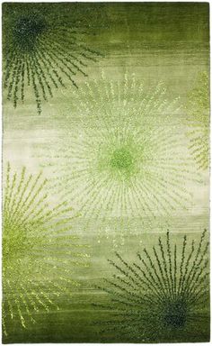 a rug with green and white designs on it