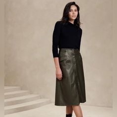 -Vegan Leather Skirt, Size S, In Olive Green Color -Lightweight, Smooth And Soft -Button Front Closure -Belt Loops -Front Pockets -Waist Darts - High Waist -Full Hem -Fully Lined -Base Fabric: 100% Rayon -Outer Coating:Polyruethane Hunter Green Leather Skirt, Leather A Line Skirt Outfit, A Line Leather Skirt Outfit, Green Leather Skirt Outfit, Midi Leather Skirt Outfit, Outfit With Leather Skirt, Leather Midi Skirt Outfit, Midi Leather Skirt, Green Leather Skirt