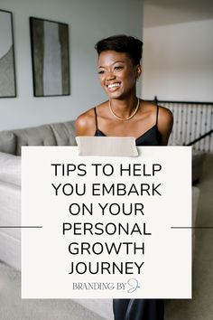 a woman holding a sign that says tips to help you embark on your personal growth journey