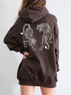 Celebrate the Year of the Tiger with this cute Aesthetic Vintage Tiger Hoodie! This Tiger Sweatshirt is super comfy! Size up for a Trendy Oversized Look! ♥ Hello and Welcome to Meaningful Tees Shop! ♥ Printed on the most popular Unisex Hoodie, the Gildan 18500 is 50% Cotton / 50% Poly. The soft fleece lining makes it super Comfy and is sure to become your new favorite! ♥ All of our items are made to order with care for each customer : ) ♥ Please allow 3-7 BUSINESS days (usually 3-5) for your ite Oversized Screen Print Hoodie, Oversized Hooded Top With Screen Print, Graphic Print Hoodie With Relaxed Fit For Loungewear, Graphic Print Relaxed Fit Hoodie For Loungewear, Relaxed Fit Graphic Hoodie For Loungewear, Fall Hooded Sweatshirt With Screen Print, Sporty Long Sleeve Hoodie With Screen Print, Screen Print Hooded Hoodie For Fall, Hooded Hoodie With Screen Print For Fall