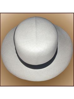 Brand: Gamboa Color: Natural Material: Toquilla Straw Brim: 8 cm. (3 1/10")Grade: 13 - 14 (Fine Fine)learn more Sweatband: Cotton Twill, 3 cm. (1.18") Crown: 11 cm. (4 1/3") Ribbon: Linen Description: A luxurious hat, handmade in Montecristi, the worldwide famous Panama Hat town in Ecuador. This Panama Colonial (Optimo) hat is a top quality, classic and elegant hat. Each hat is individually blocked and trimmed to meet the highest quality standards.Roll Up Elegant White Hat With Flat Crown, White Brimmed Panama Hat For Formal Occasions, White Formal Panama Hat, Classic White Straw Hat With Flat Crown, Classic White Flat Crown Straw Hat, Classic White Hat With Flat Crown, Classic White Flat Crown Hat, White Formal Hat With Flat Crown, Fitted Panama Hat With Flat Crown For Formal Occasions