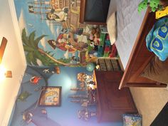 a child's bedroom with pirate themed wallpaper and bed in the foreground