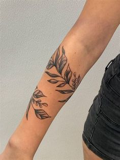 a woman with a tattoo on her arm