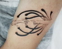 a tattoo on the arm of a man with arrows coming out of his body and hands