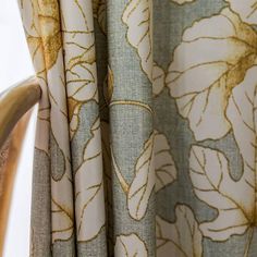 closeup of curtains with flowers on them