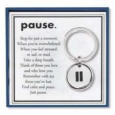 a keychain with the words pause written on it and a poem about love